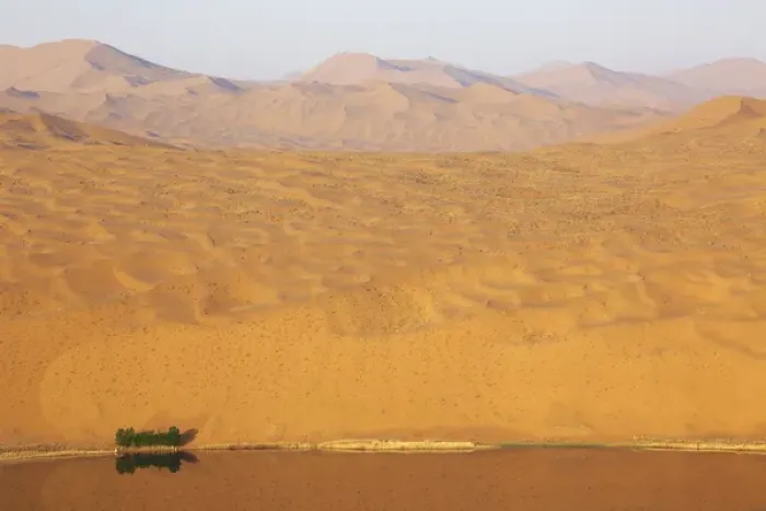 Framed Print : China, Inner Mongolia, Badan Jilin Desert. Desert vastness next to lake. Credit as Framed Print : China, Inner Mongolia, Badan Jilin Desert. Desert vastness next to lake. Credit as