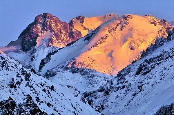 China, Xinjiang, Bogda Peak. Dawns red light creeps over Bogda Peak, in the Tien Shan Range