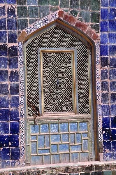 China, Xinjiang, Kashgar. This arched, grilled window is surrounded by lapis