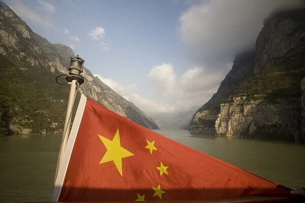 Chinese flag astern as passes through a Yangzi gorge. Chinese flag and Qutang Gorge