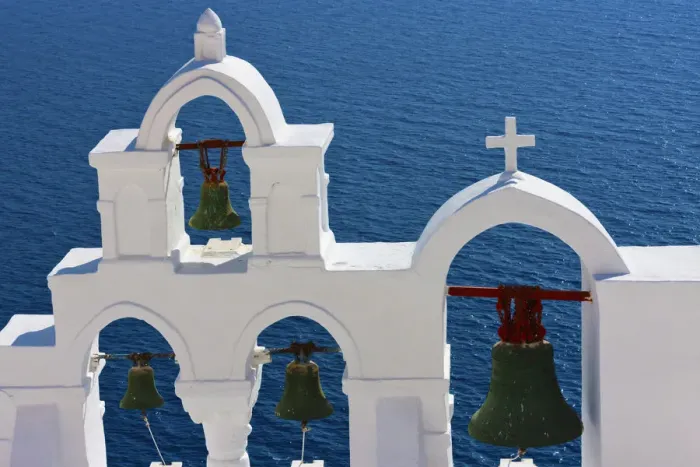 Framed Print : Church bell tower on the coast of Aegean Sea. Oia, Santorini Island, Greece