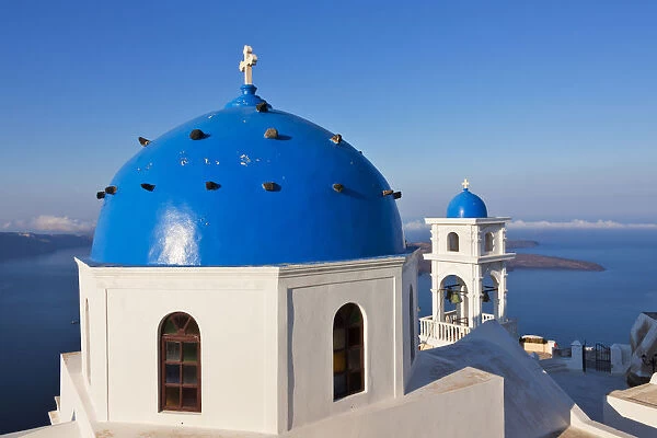 Church on the coast of Aegean Sea. Oia, Santorini Island, Greece