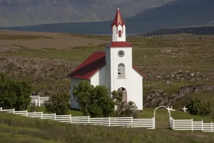 Framed Print : Church and farm in pastoral valley at foot of Mt. Helgafell in southwest Iceland