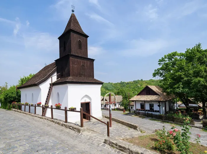 Framed Print : The church. The Paloc village Holloko in Hungary, listed as UNESCO World Heritage Site. The traditional farm houses form a complete village as it looked during the middle ages Framed Print : The church. The Paloc village Holloko in Hungary, listed as UNESCO World Heritage Site. The traditional farm houses form a complete village as it looked during the middle ages