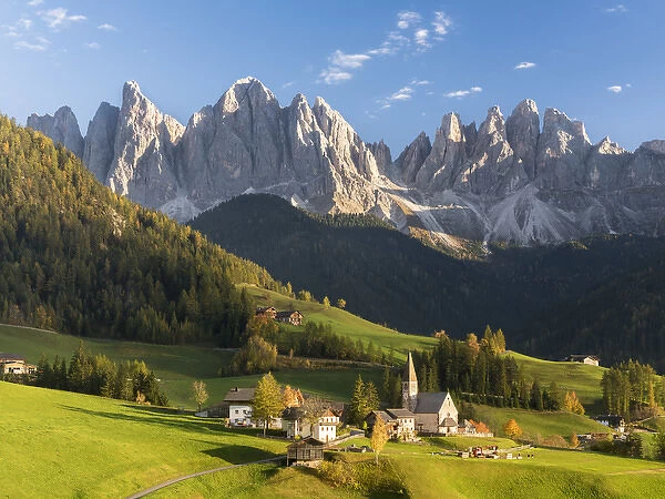 The church Sankt Magdalena in the Villnoess valley in the Dolomites during autumn