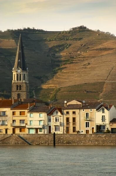 The church in Tain and houses along the river. The Hermitage vineyards on the hill