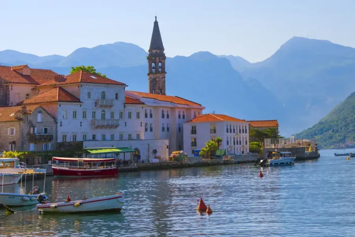 Framed Print : Church tower and houses on the Adriatic coast, Perast, Montenegro