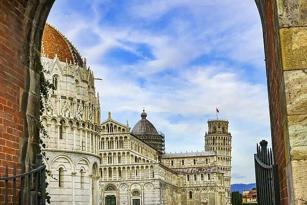 City gate of Piazza del Miracoli with Leaning Tower of Pisa and Pisa Baptistery of St
