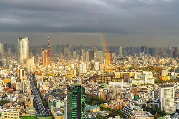 Cityscape of Tokyo at sunset with a rainbow as viewed from Shibuya Scramble Square in