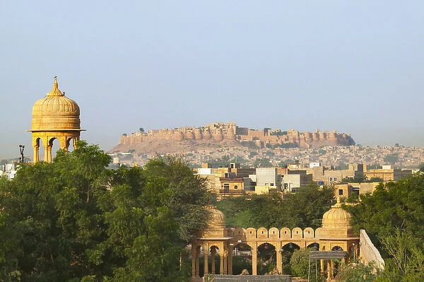 Cityscape of traditional architecture, Jasailmer Fort in the distance, Jaisalmer