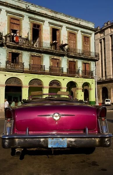 Classic 50s Buick colorful convertible auto in Havana Cuba Habana in front of old worn