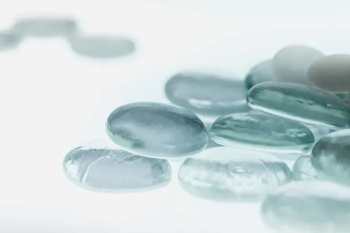 Framed Print : Clear Glass Pebbles with light