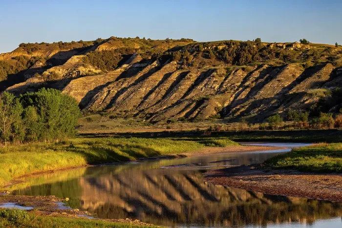 Framed Print : Cliffs reflection in the Little Missouri River at sunrise in Theodore Roosevelt National Park, North Dakota, USA. (Editorial Use Only) Framed Print : Cliffs reflection in the Little Missouri River at sunrise in Theodore Roosevelt National Park, North Dakota, USA. (Editorial Use Only)