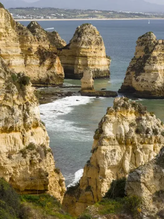 Framed Print : The cliffs and sea stacks of Ponta da Piedade at the rocky coast of the Algarve in Portugal