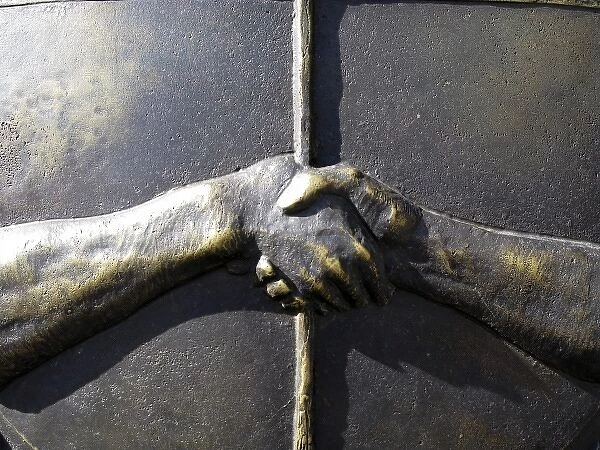 close up of the Argentine Seal: hands shaking
