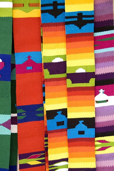 Close up of colorful fabrics and artwork shawls in Antigua Guatemala