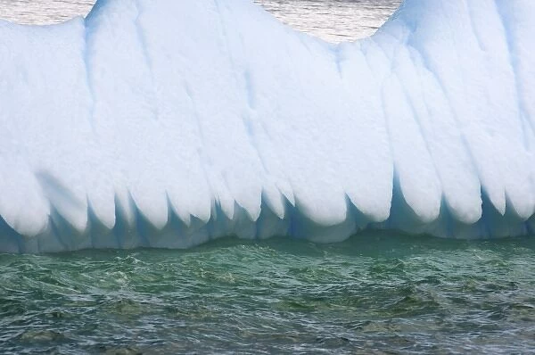 close up of the edge of an iceberg floating off the western Antarctic peninsula, Antarctica