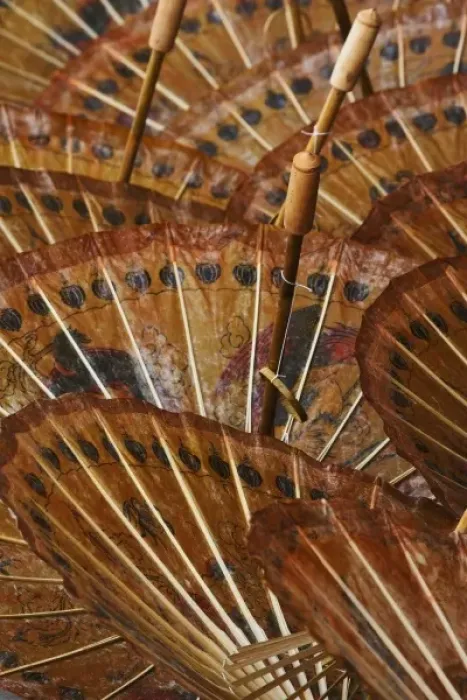 Framed Print : Close-up pattern of hand painted decorative umbrellas on sidewalk at market in Bo Sang