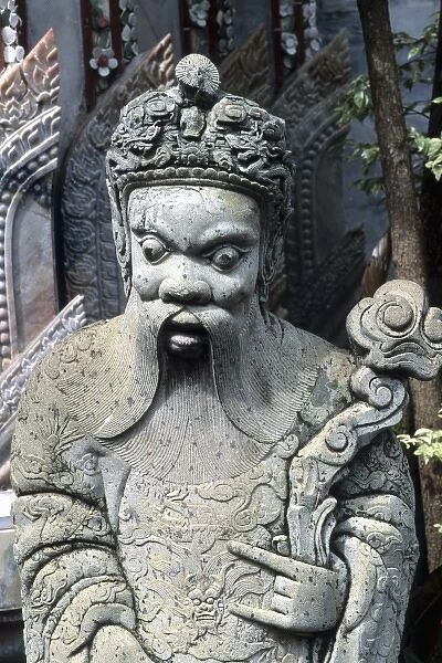 Close-up of stone statue graphic in Grand Palace in Bangkok Thailand