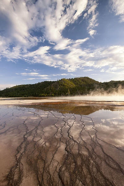 Cloud reflections over chemical Sediments. Yellowstone National Park. Wyoming