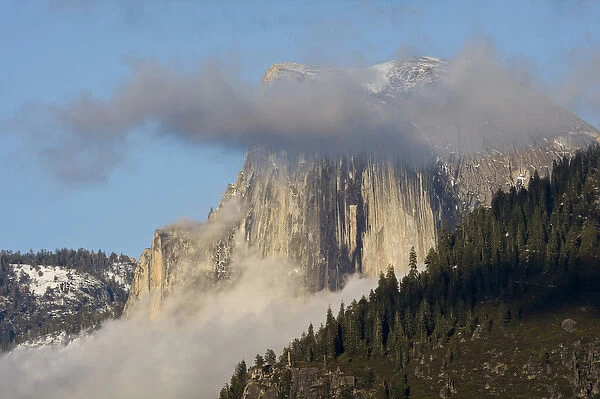 Clouds and fog gather around Half Dome - Yosemite National Park, California