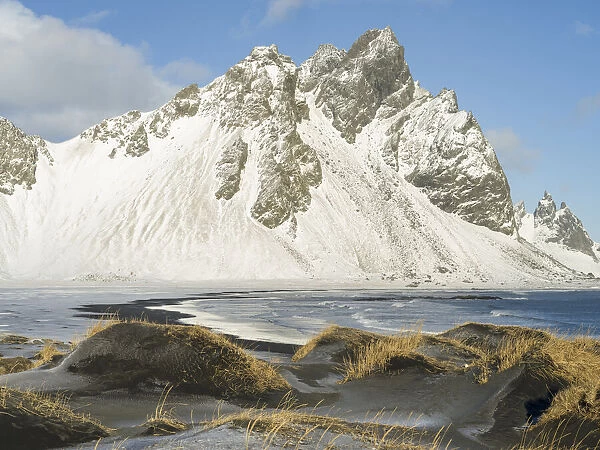 Coastal landscape with dunes at iconic Stokksnes during winter and stormy conditions
