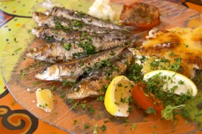Framed Print : Collioure. Roussillon. Grilled sardines with potato gratin. France. Europe