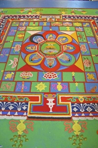 Colored sand mandala created by Buddhist monk