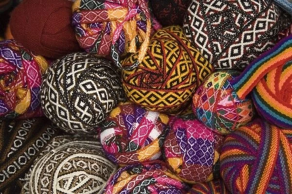 Colorful balls of trim displayed in market, Cuzco, Peru