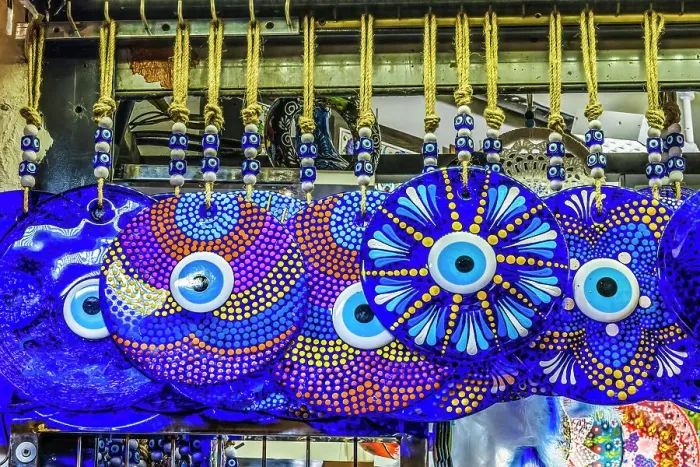 Framed Print : Colorful blue evil eye charms, Grand Bazaar, Istanbul, Turkey. Evil Eye Charm protects family against evil energy and spirits. Originally from Ancient Greece and Rome, but has origins in many religions and cultures