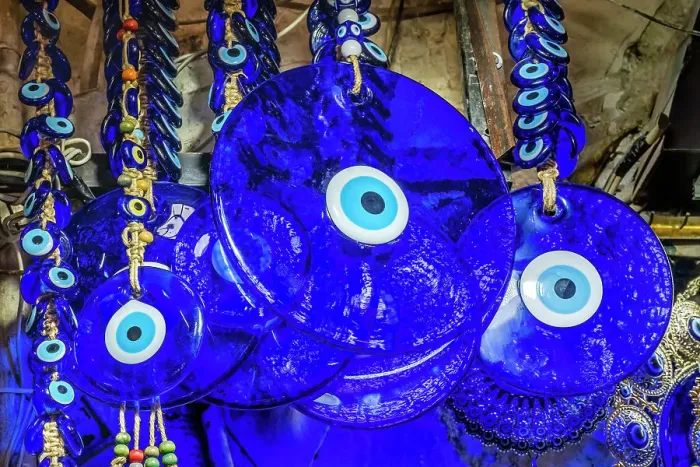 Framed Print : Colorful blue evil eye charms, Grand Bazaar, Istanbul, Turkey. Evil Eye Charm protects family against evil energy and spirits. Originally from Ancient Greece and Rome, but has origins in many religions and cultures