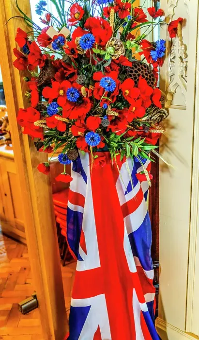 Framed Print : Colorful D-Day memorial flowers poppies, UK Flag, St. Saviour's Church, Dartmouth, Devon, England. Church originally founded in 1372. (Editorial Use Only)