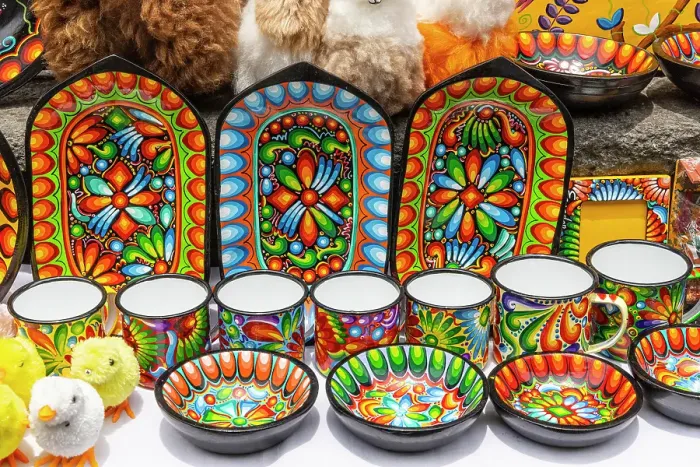 Framed Print : Colorful dishes, and stuffed ducks were on sale on the walls of the Basilica of Quito