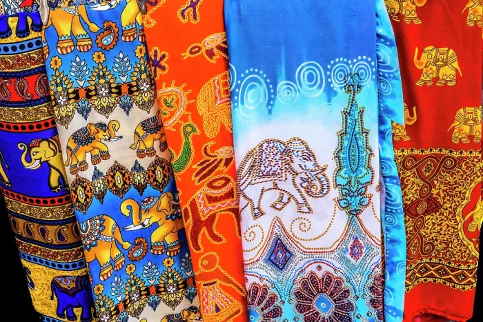 Framed Print : Colorful elephant pants souvenir, Bangkok, Thailand. A popular souvenir that are light and airy in hot climate