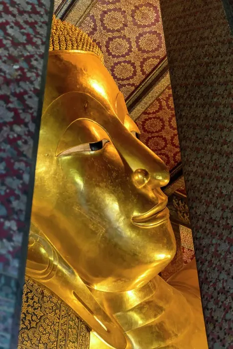 Framed Print : Colorful face Reclining Buddha, Wat Pho Temple, Bangkok, Thailand. Temple built in 1600's. Reclining Buddha built in 1832