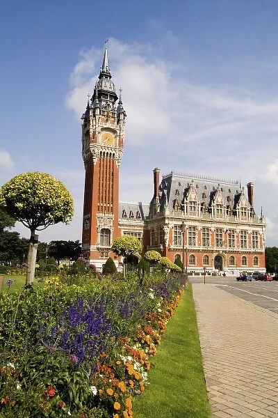 Colorful flowers in sunshine of beautiful Hotel de Ville architecture in small French