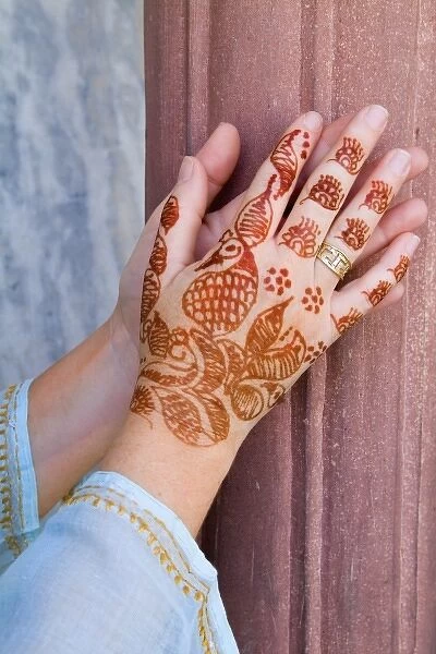 Colorful Henna design on womans hands artwork for celebration tatoos in Delhi India (MR)
