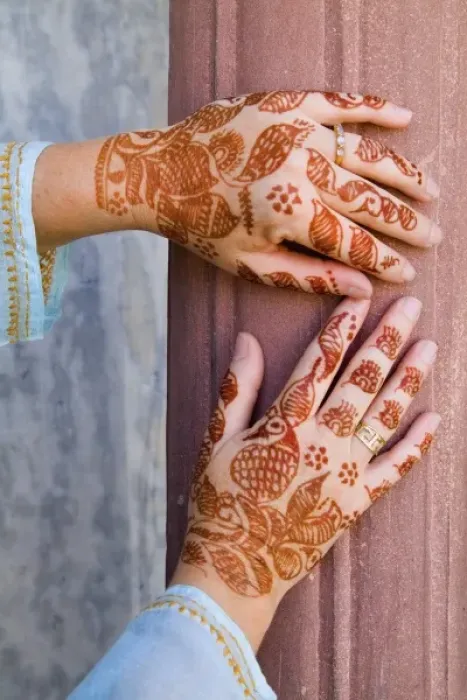 Framed Print : Colorful Henna design on womans hands artwork for celebration tatoos in Delhi India Framed Print : Colorful Henna design on womans hands artwork for celebration tatoos in Delhi India