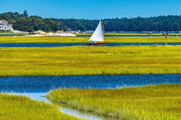 Colorful sailboat, Westport, Massachusetts. Osprey nests, marshland