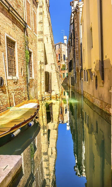 Colorful small boats. Building reflection, Venice, Italy