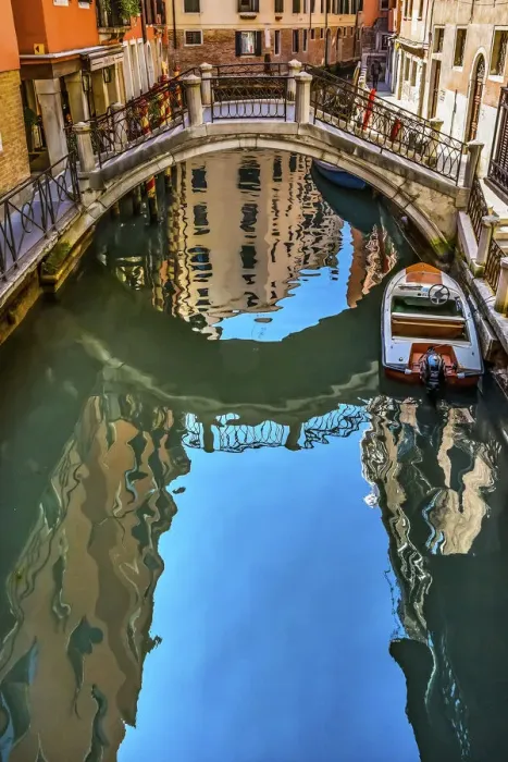 Framed Print : Colorful small canal and bridge creates beautiful reflections in Venice, Italy