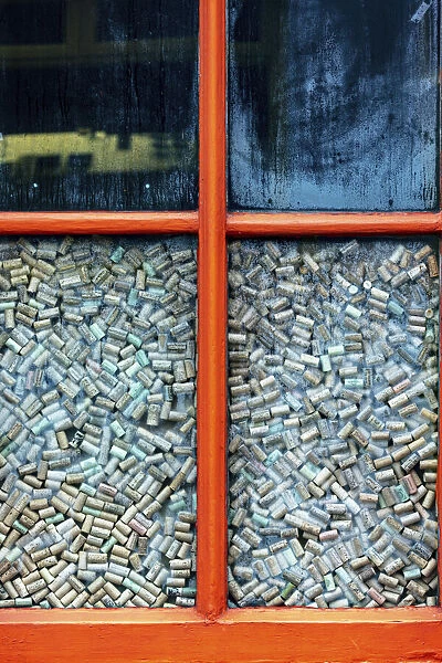 Colorful window full of wine corks in Ennistymon, Ireland
