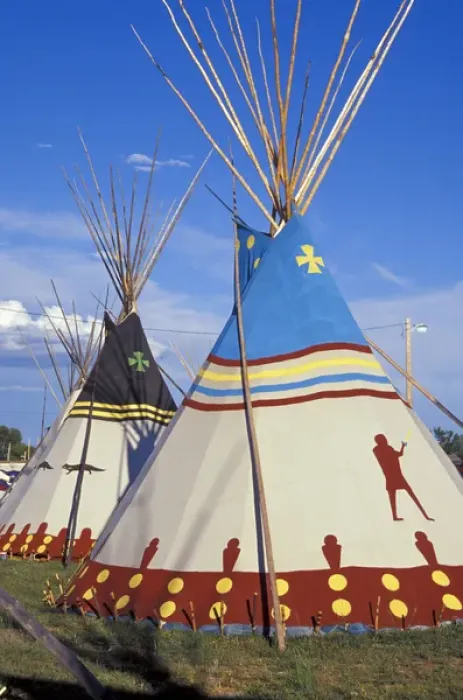 Framed Print : Colorfully painted with decorative designs on Blackfeet tepees made from canvas stretched