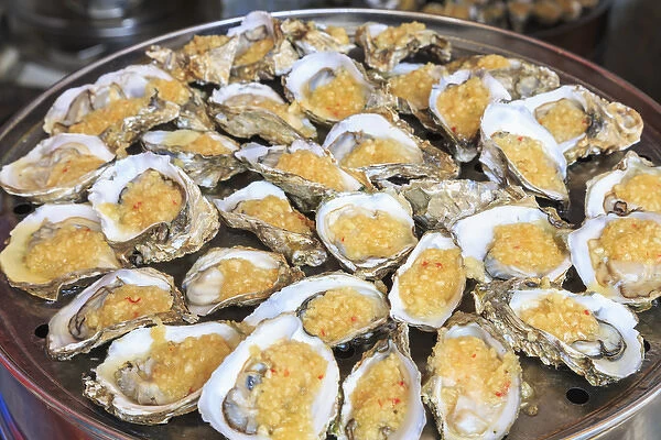 cooked oysters on a platter, shops around Nine Pedestrian Street, Guangzhou, China