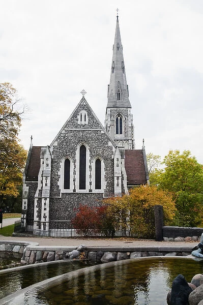 Copenhagen, Denmark - An ancient church with a steeple in a rural setting. In the
