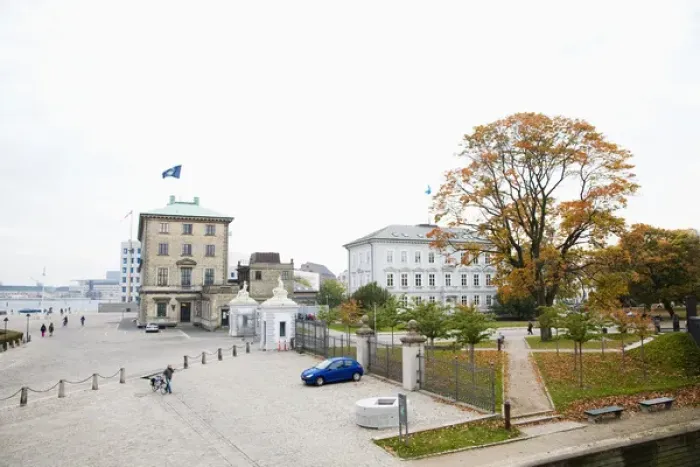 Framed Print : Copenhagen, Denmark - Cobblestone square in front of an old world building next to a city park Framed Print : Copenhagen, Denmark - Cobblestone square in front of an old world building next to a city park