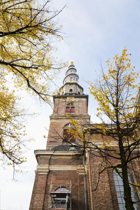 Framed Print : Copenhagen, Denmark - Low angle view of an ornate spire on an old world church. Vertical Framed Print : Copenhagen, Denmark - Low angle view of an ornate spire on an old world church. Vertical