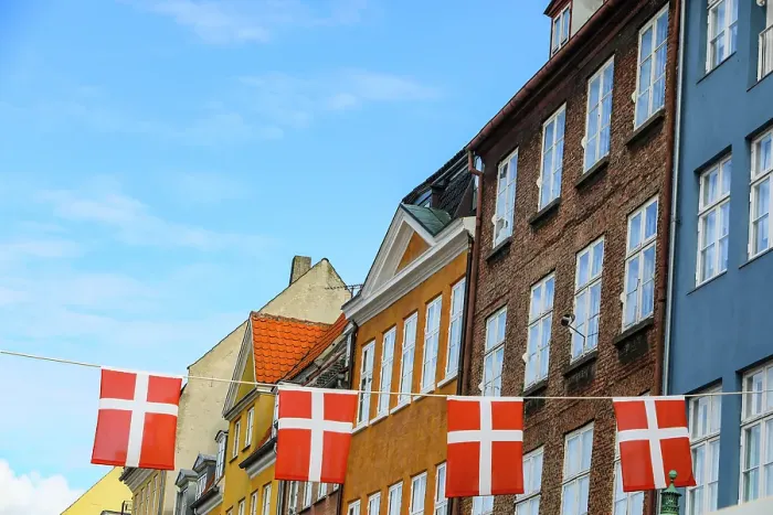 Framed Print : Copenhagen, Denmark. Nyhavn area, colorful painted houses, Denmark flag