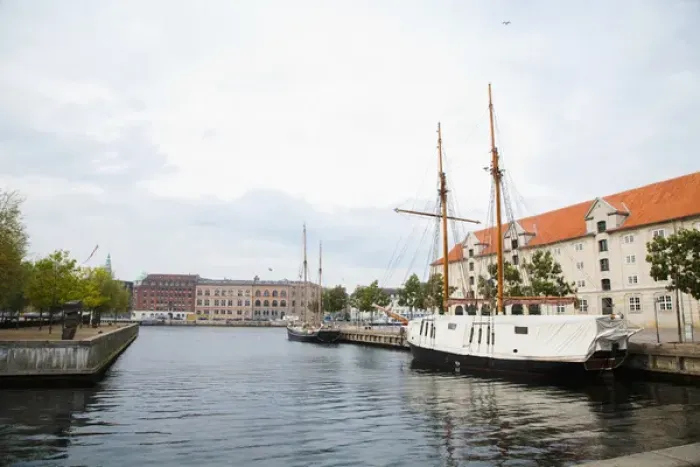 Framed Print : Copenhagen, Denmark - On old world, waterfront city. A boat are viewable on the water Framed Print : Copenhagen, Denmark - On old world, waterfront city. A boat are viewable on the water