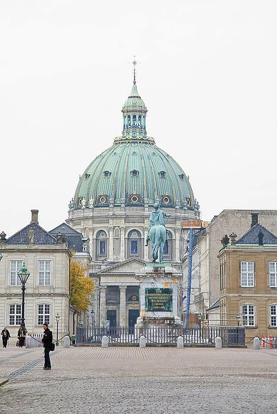 Copenhagen, Denmark - An ornate, domed building with a statue in the foreground